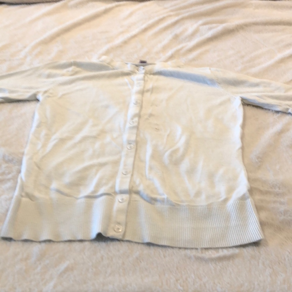 White blouse with button.